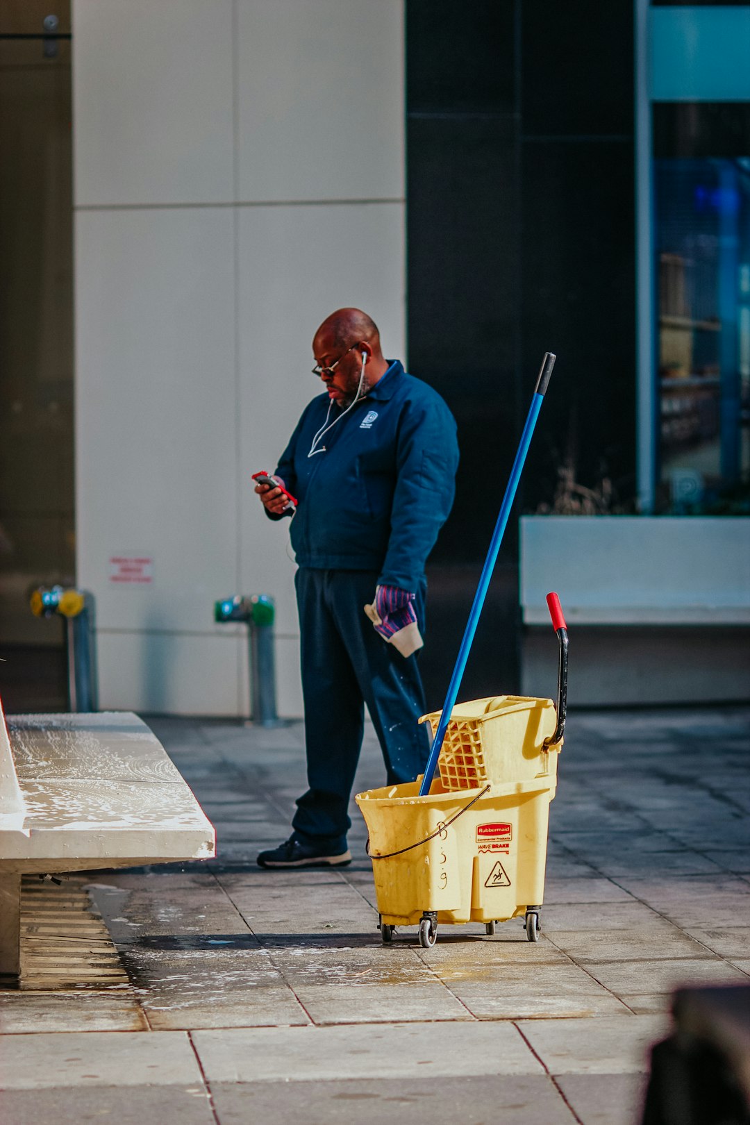 project-03-b man-in-blue-suit-holding-yellow-plastic-basket-jgaxgjxklpw